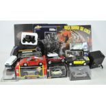 A collection of assorted toy cars, some boxed, further toys, a vase,