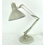 A vintage anglepoise lamp stamped 'Norway', retailed by '1001 Lamps, London', cream coloured,
