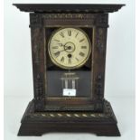An early 20th century mantel clock by Junghams, the dial with Roman numerals denoting hours,