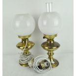 Two oil lamps, one converted to electricity, the other by Duplex, both with original glass shades,