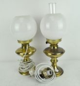 Two oil lamps, one converted to electricity, the other by Duplex, both with original glass shades,