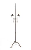 A wrought iron twin candlestick, late 19th/early 20th century,
