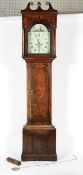 An early 19th century oak long case clock with inlaid decoration,