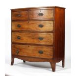 An early 19th century mahogany and inlaid bow fronted chest of drawers,
