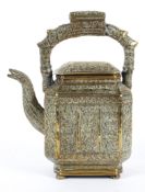 A Middle Eastern or Indian brass teapot and cover, probably 19th century,
