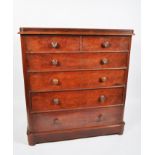 A Victorian mahogany chest of drawers, two short and four graduated long drawers with turned pulls,