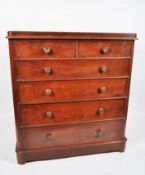 A Victorian mahogany chest of drawers, two short and four graduated long drawers with turned pulls,