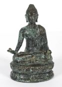 An Asian bronze model of a Buddha, 20th century cast seated cross-legged on a lotus flowers,