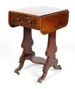 A 19th century mahogany work table, with folding top above a frieze drawer, on lyre shaped supports,