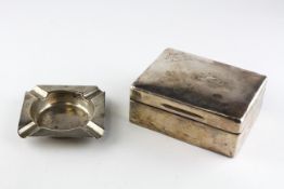 A silver cigarette box of rectangular form, hallmarked London 1935 by SJ Rose,