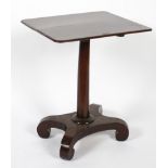 A William IV mahogany tilt top table on waisted rectangular base, issuing scroll feet,