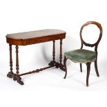 A Victorian mahogany writing table and a balloon back chair, late 19th century,