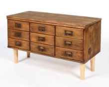 An early/mid 20th century vintage oak nine drawer sideboard with index card holder handles,