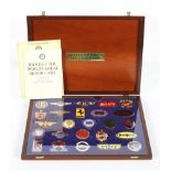 Badges of the Worlds Great Motor Cars, a collection of 25 enamelled plaques, in collectors case,