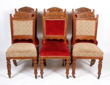 A set of six Edwardian oak dining chairs, with foliate carved back,