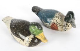 Folk Art: Two wooden decoy ducks, adzed and painted, paper label saying 'Original by Peter ****',