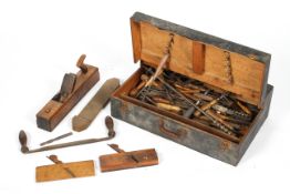 A collection of vintage carpenter's tools, including planes and other items,