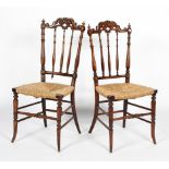 A pair of 19th century walnut and rush seated chairs,