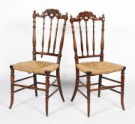 A pair of 19th century walnut and rush seated chairs,