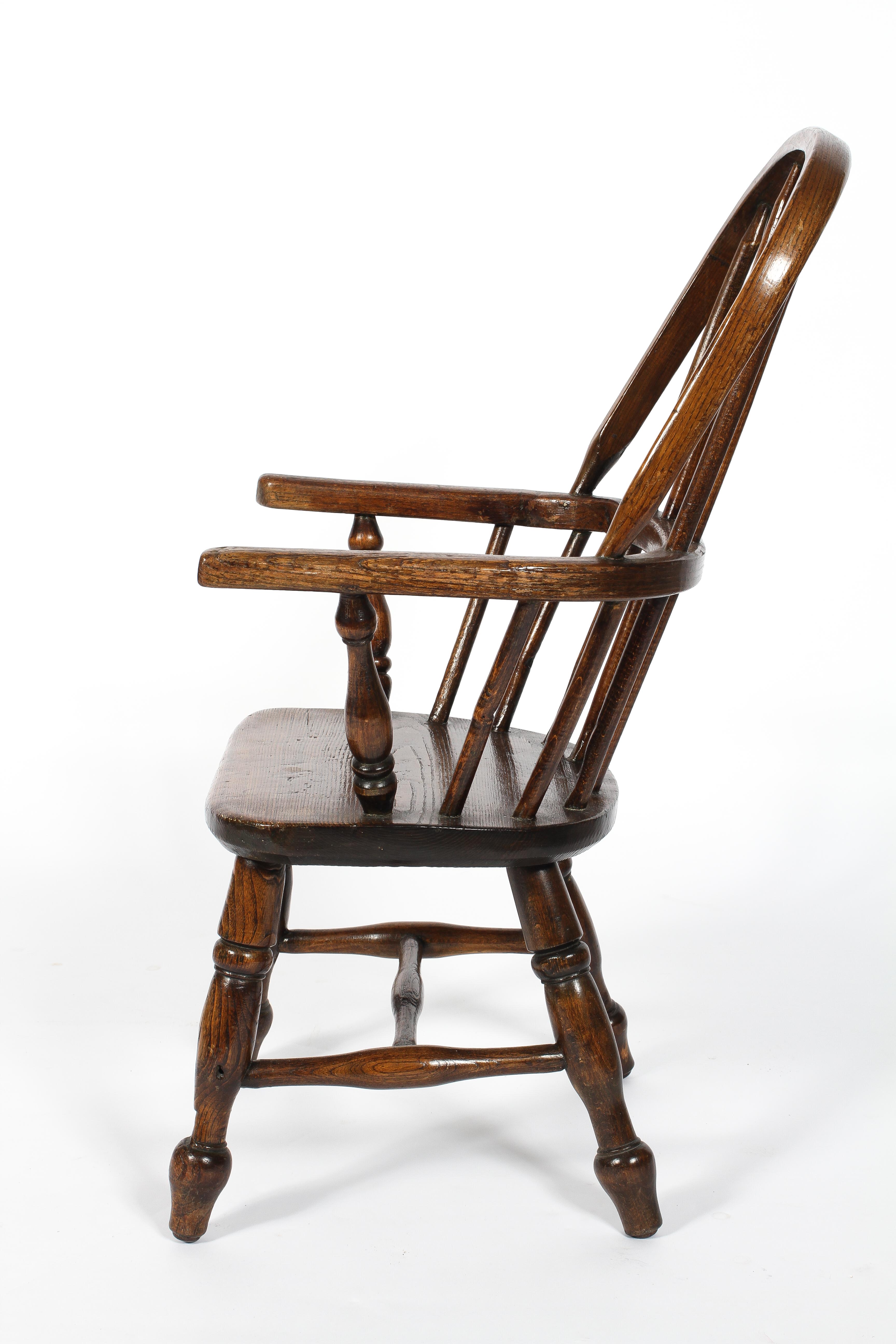 A child's elm Windsor chair, on turned baluster splayed legs, - Image 2 of 2