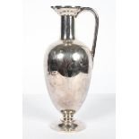 A silver plated wine ewer, early 20th century, engraved with swags of husks, with hinged cover,