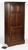 A 19th century oak corner hall robe, with two panelled doors,