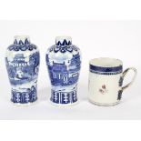 A pair of Chinese porcelain baluster blue and white vases decorated with a scene of a lakeside