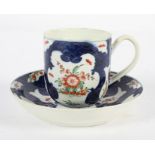 A Worcester Coffee Cup and Saucer, circa 1770, in a Japan pattern on a blue scale ground,
