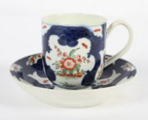 A Worcester Coffee Cup and Saucer, circa 1770, in a Japan pattern on a blue scale ground,