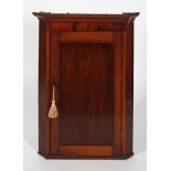 A Georgian mahogany corner cupboard, late 18th century,