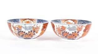 A pair of Imari fruit bowls, 20th century, with floral decoration beneath a panelled border,