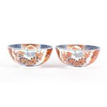 A pair of Imari fruit bowls, 20th century, with floral decoration beneath a panelled border,