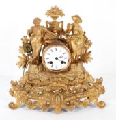 A French gilt metal mantel clock, the 3" enamelled dial on a brass, eight day movement