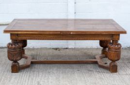 A Jacobean style large oak draw leaf refectory style table,