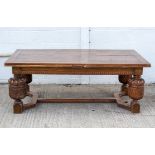 A Jacobean style large oak draw leaf refectory style table,