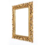 A Florentine style carved giltwood rectangular mirror, 20th century,