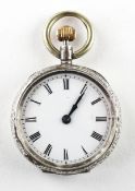 A mid size open face pocket watch. Circular white dial with roman numerals.