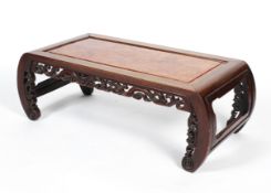A Chinese hardwood opium or coffee table, with foliate carved frieze and curved legs, 32cm high,