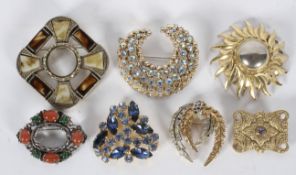 A collection of twenty costume brooches of variable designs, gross weight 257 grams.