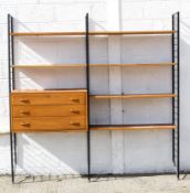 A Ladderax display unit, with a set of three drawers and six shelves on three supports,