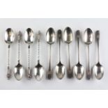 A set of six George V silver coffee spoons, the handles with feathered edges,