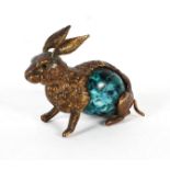 A novelty gilt metal tape meaure holder in the form of a rabbit, the tail acting as a winder,