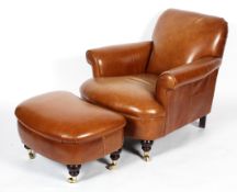 A contemporary Laura Ashley tan leather armchair and a kidney-shaped stool,