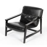 A late 20th century lounge chair with ebonised frame and upholstered seat in a faux leather fabric,