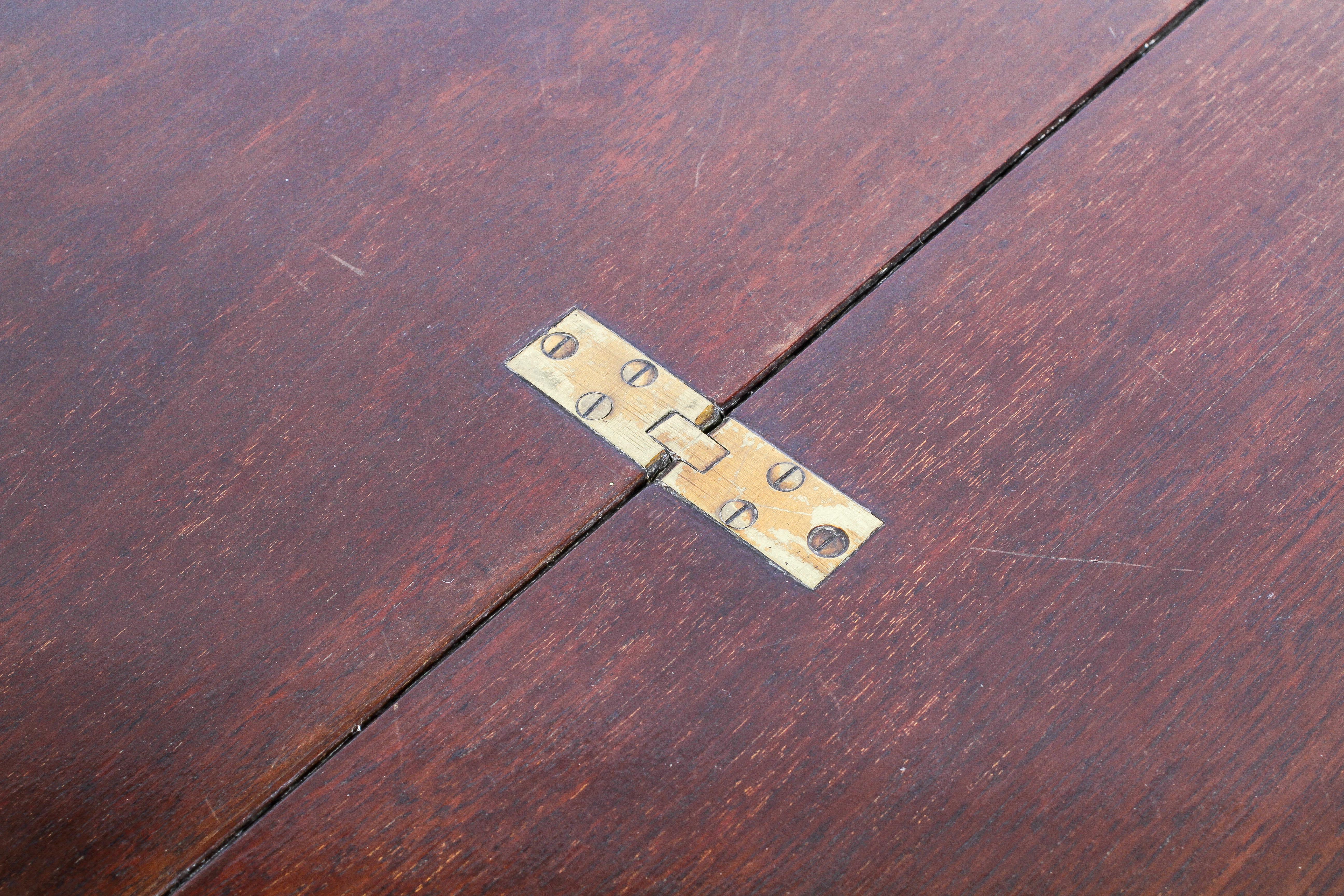 A Victorian mahogany coaching table, the circular top on a folding X frame, 60cm high, - Image 3 of 3