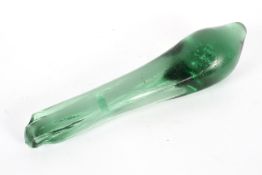 A large green glass clump, of extended dump form, with bubble inclusions,