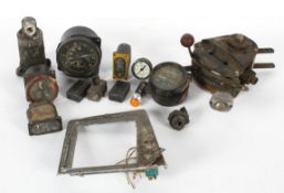 A collection of World War 2 aircraft dials, perhaps from a Spitfire, including an altimeter,