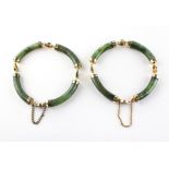 A pair of bracelets of identical design having cylindrical links in the style of nephrite jade