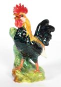 A Continental majolica spill-vase modelled as a chicken, probably French,