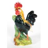 A Continental majolica spill-vase modelled as a chicken, probably French,